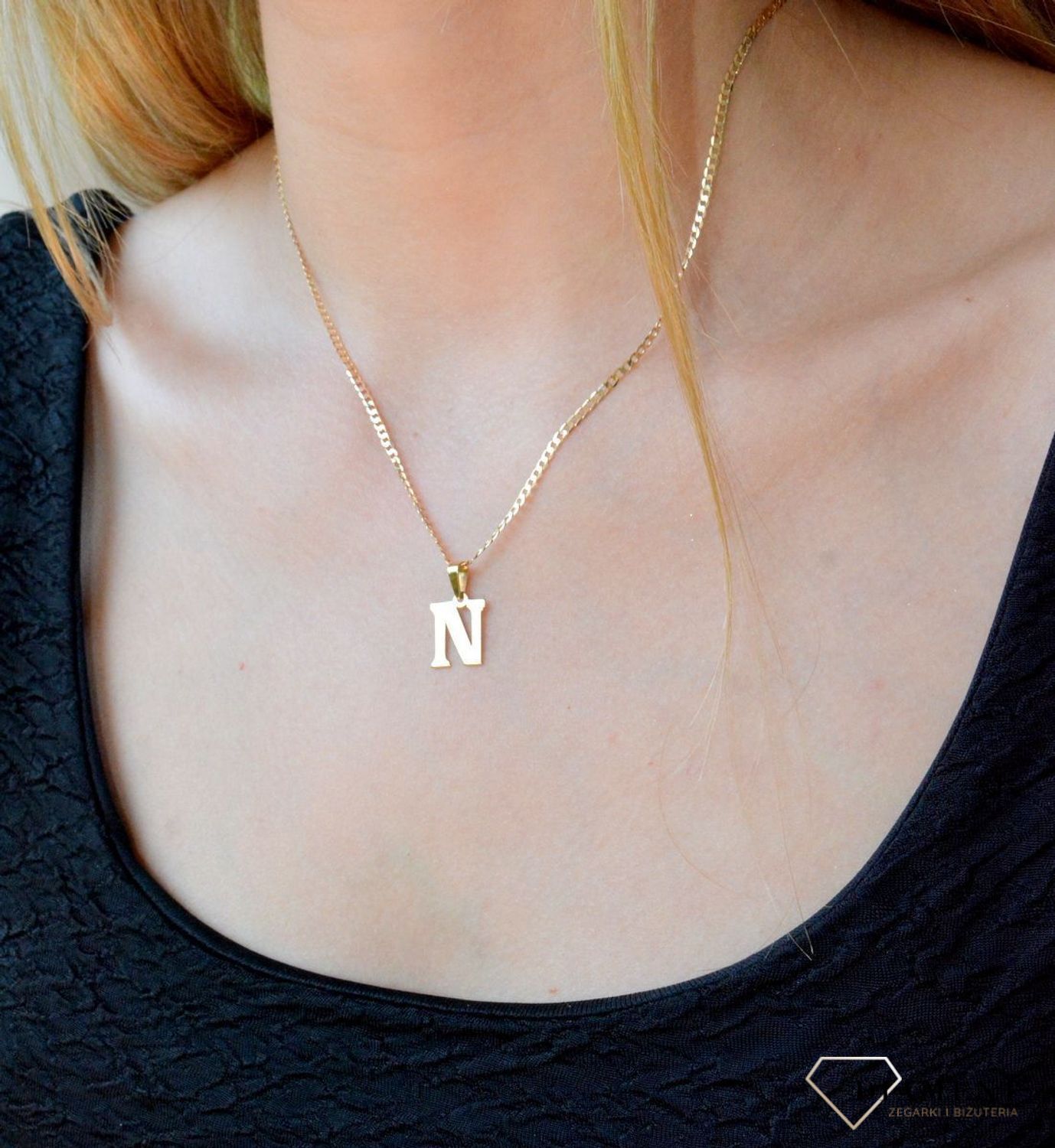 Złota zawieszka 585 literka N DIA-ZAW-10066-585. Wisiorek został wykonany z wysokiej jakości złota próby 585. Wisiorek z literką N. Literka N zawieszka idealna na prezent. Złota zawieszka damska literka..jpg
