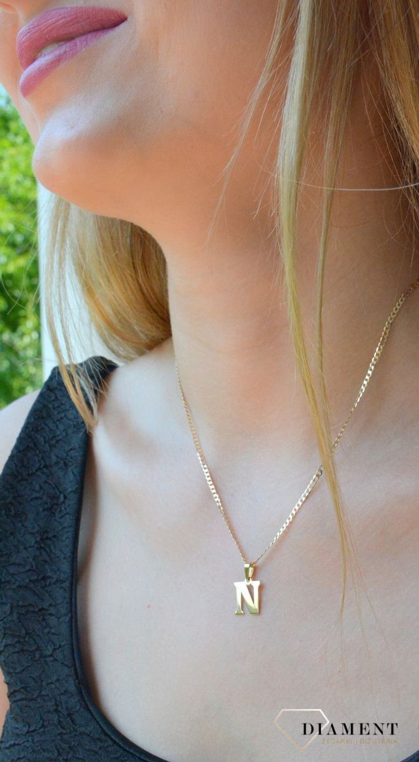 Złota zawieszka 585 literka N DIA-ZAW-10066-585. Wisiorek został wykonany z wysokiej jakości złota próby 585. Wisiorek z literką N. Literka N zawieszka idealna na prezent. Złota zawieszka damska literka..jpg