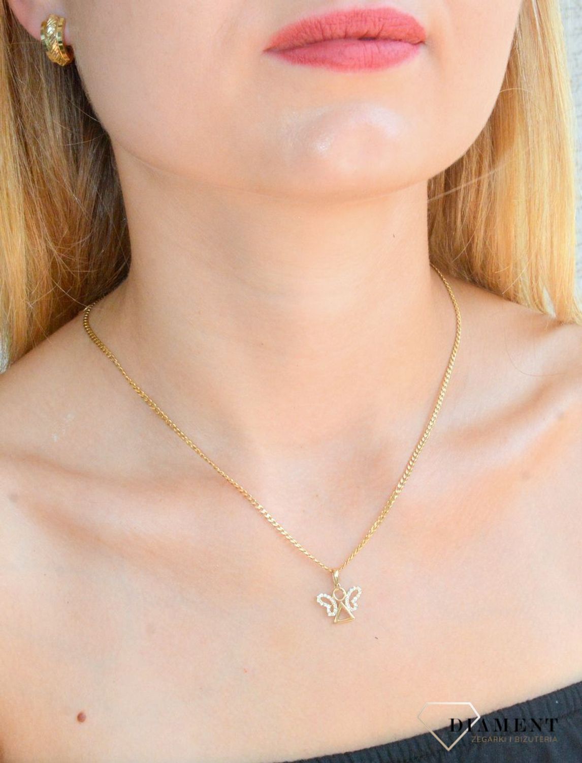 Zawieszka złota  Biżuteryjny Aniołek 585 DIA-ZAW-10419-585 Zawieszka wykonana z żółtego 14 karatowego złota o oryginalnej i ponadczasowej formie. Biżuteria idealna do każdego typu łańcuszka. Fantastyczny pomysł n.jpg