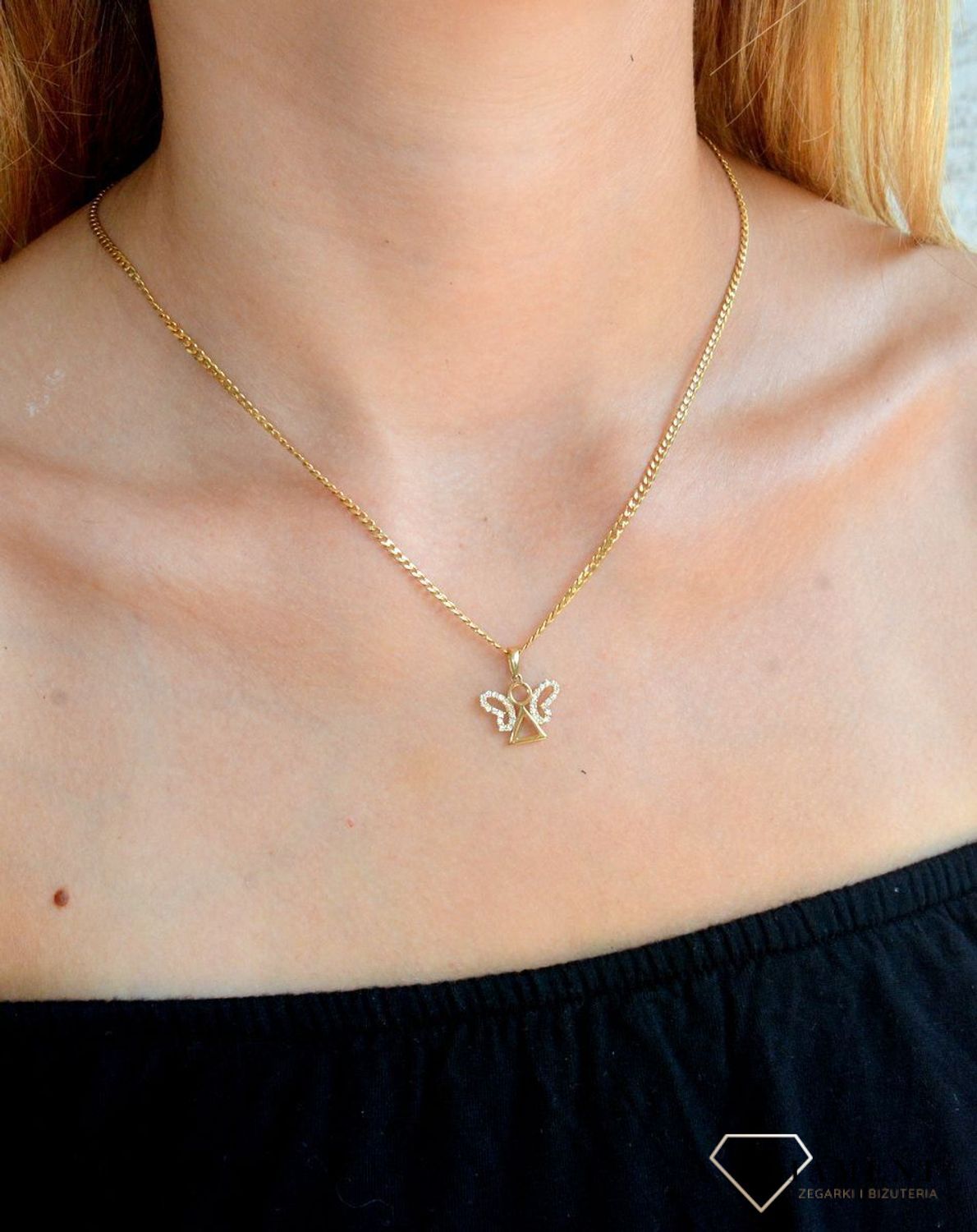 Zawieszka złota  Biżuteryjny Aniołek 585 DIA-ZAW-10419-585 Zawieszka wykonana z żółtego 14 karatowego złota o oryginalnej i ponadczasowej formie. Biżuteria idealna do każdego typu łańcuszka. Fantastyczny pomysł n.jpg