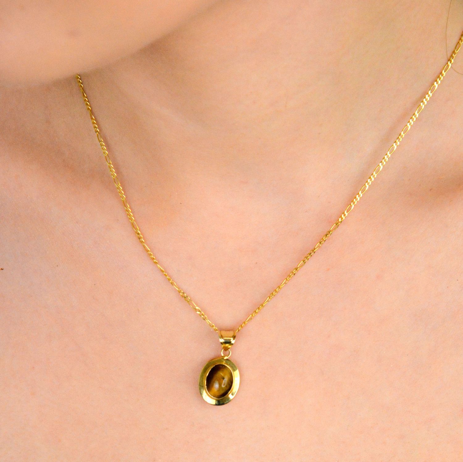 Zawieszka złota 585 Tygrysie Oko DIA-ZAW-11125-585 Zawieszka została wykonana z najwyższej jakości żółtego złota, próby 585. Zawieszka o owalnym kształcie z kamieniem naturalnym 1.jpg