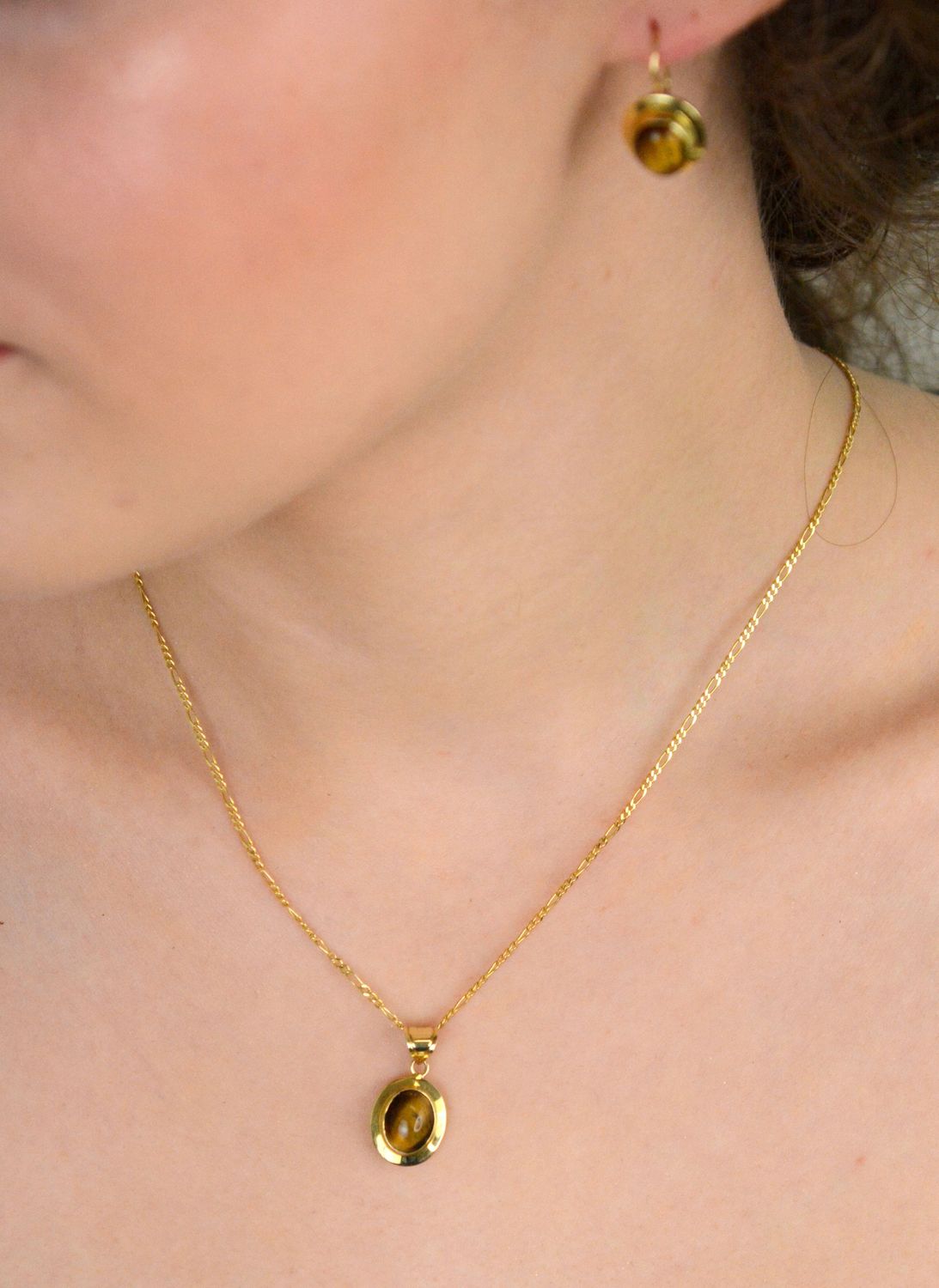 Zawieszka złota 585 Tygrysie Oko DIA-ZAW-11125-585 Zawieszka została wykonana z najwyższej jakości żółtego złota, próby 585. Zawieszka o owalnym kształcie z kamieniem naturalnym 1.jpg