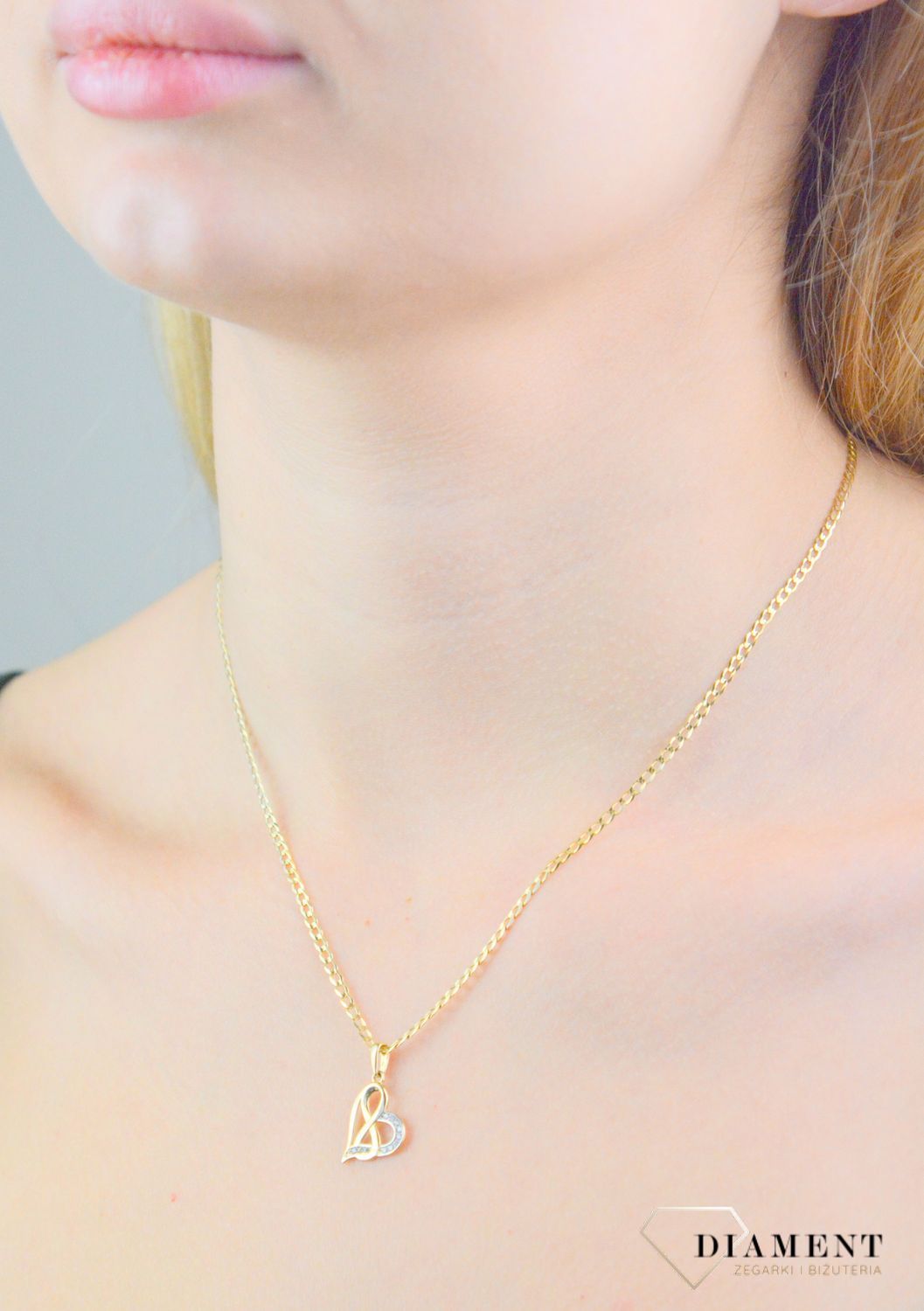 Zawieszka serduszko z nieskończonością cyrkoniami próba próba 585, DIA-ZAW-12154-585 Piękna zawieszka w kształcie serca z nieskończonością, wykonana ze złota próby 585..jpg