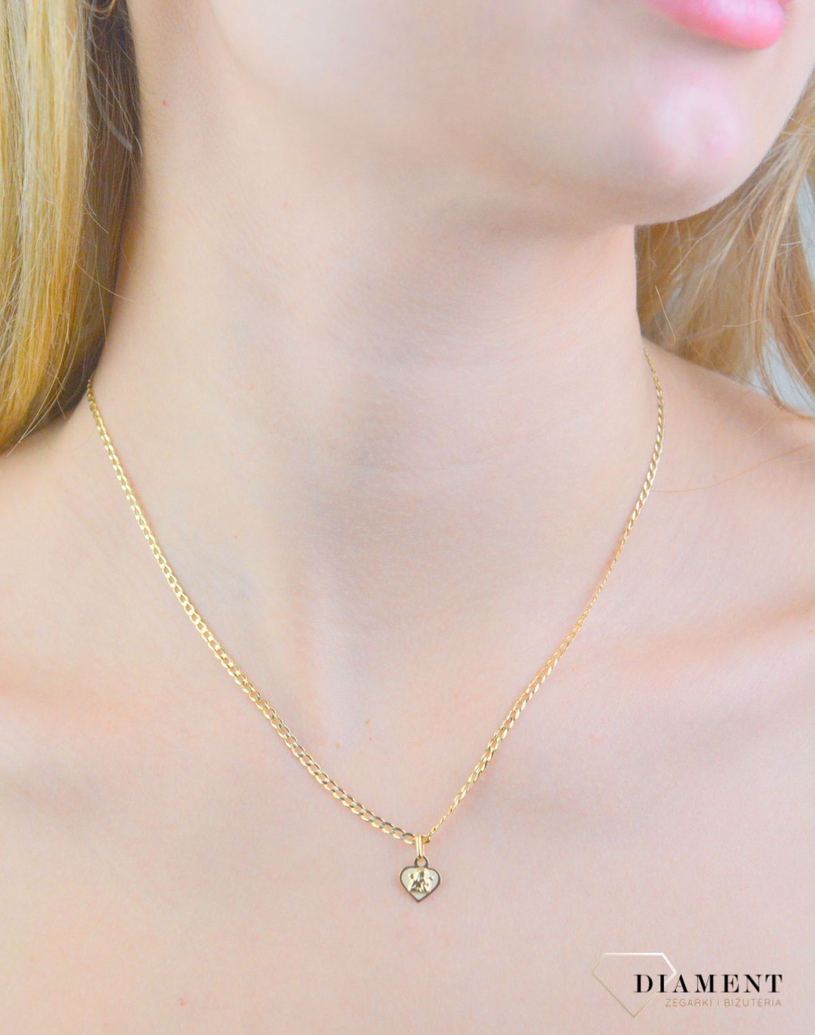 Zawieszka złota serce aniołek próba 585, DIA-ZAW-12176-585 Złota zawieszka 585 medalik aniołek w serduszku. Medalik będący wspaniałą pamiątką i prezentem z okazji chrztu, komunii czy bierzmowania.1.jpg