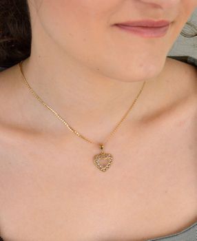 Zawieszka złote serce ażurowe z białym złotem próba 333, DIA-ZAW-1531-333 Elegancka złota zawieszka w kształcie ażurowego serca, ozdobiona białym złotem i pustą przestrzenią w środku, co nadaje jej subtelny, ale wyjątko.JPG
