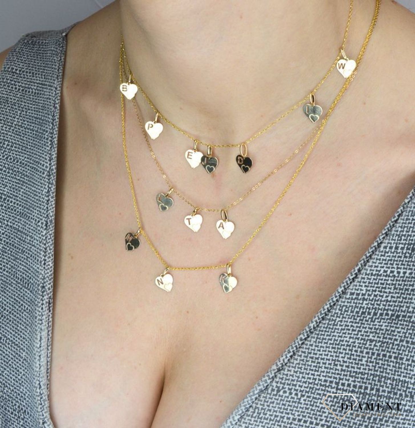 Złota zawieszka 585 serce z literką E DIA-ZAW-2607E-585.jpg