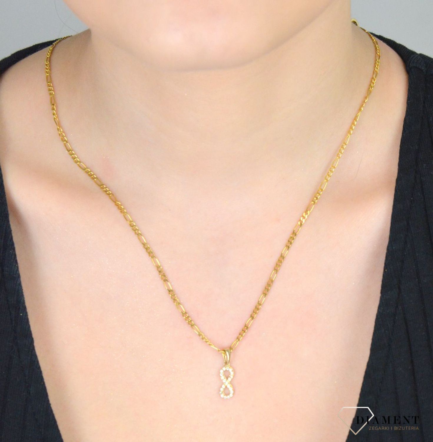 Zawieszka złota nieskończoność z cyrkoniami pr 585, DIA-ZAW-3674-585. Wisiorek został wykonany z wysokiej jakości złota próby 585. Złoto to jeden z najpopularniejszych kruszców, cenione przez 1.jpg