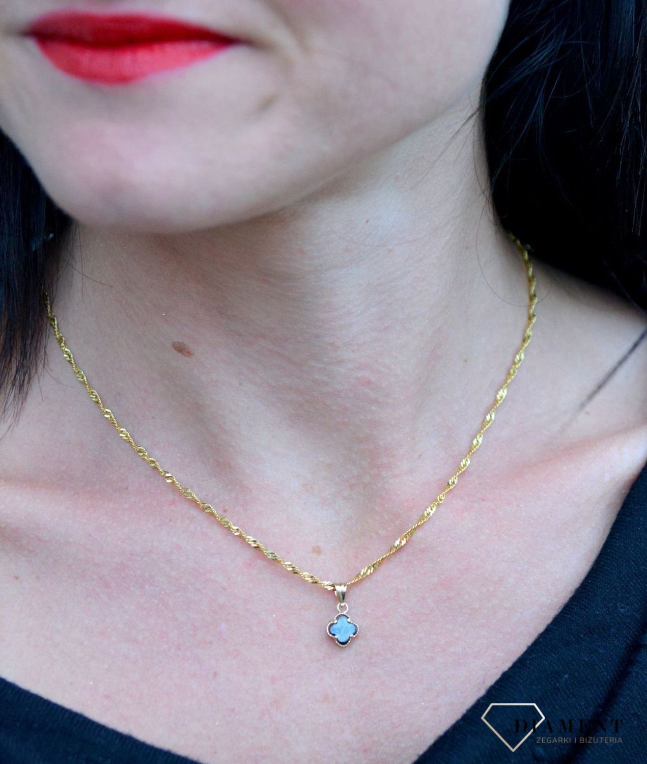 Złota zawieszka 585 koniczynka z onyksem DIA-ZAW-4195-585. Złota zawieszka koniczynka z onyksem wykonana z najwyższej próby 585..jpg