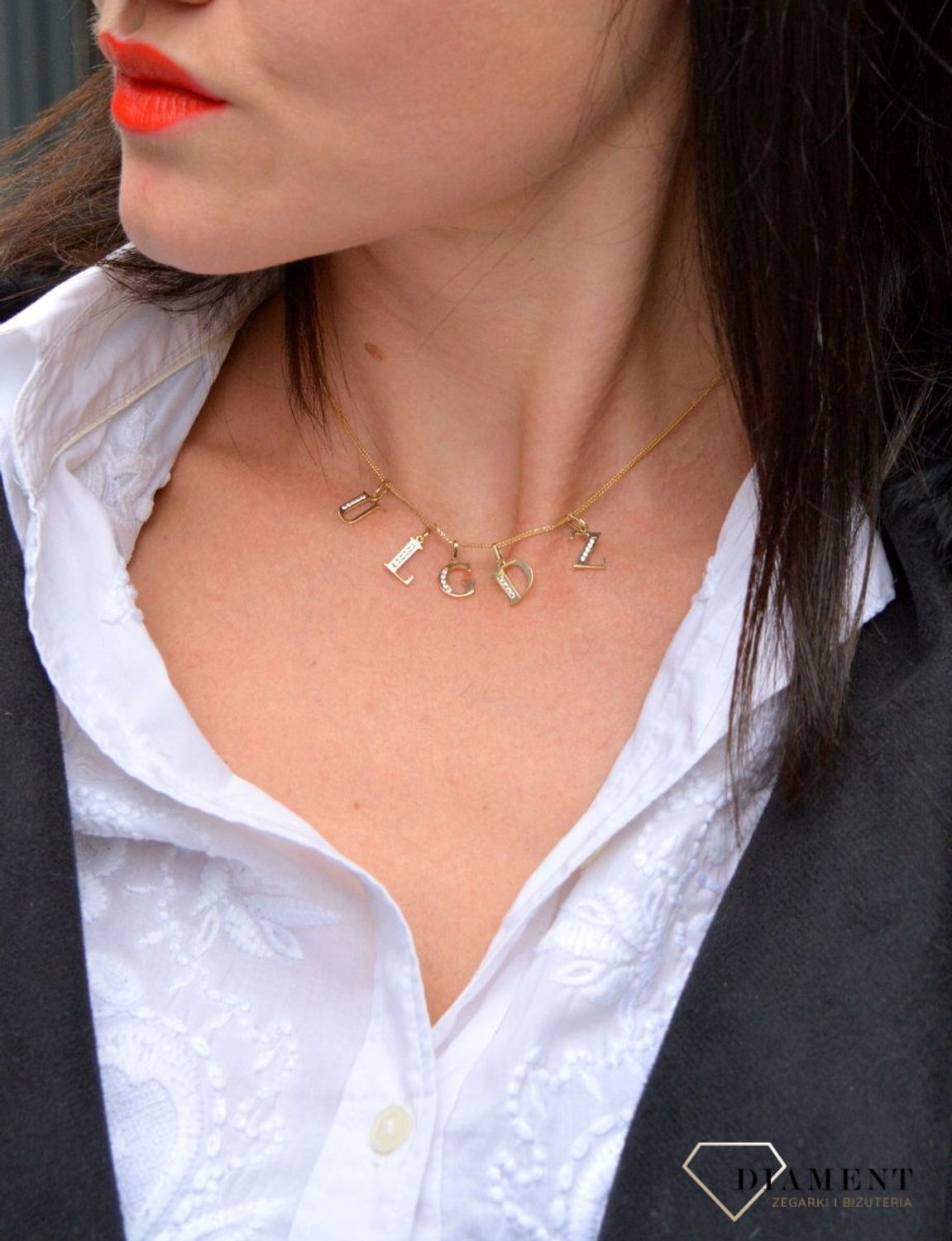 Złota zawieszka w kształcie literki D wykonana z wysokiej próby złota 585..jpg