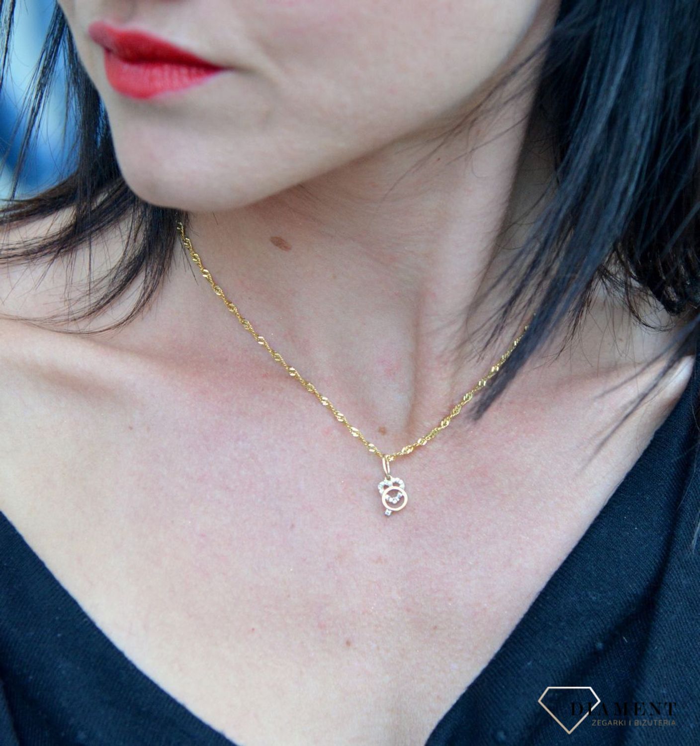 Złota zawieszka serce z cyrkonią i pierścionek DIA-ZAW-4399-585. Złota zawieszka w kształcie serca ozdobionego cyrkonią i pierścionek.jpg