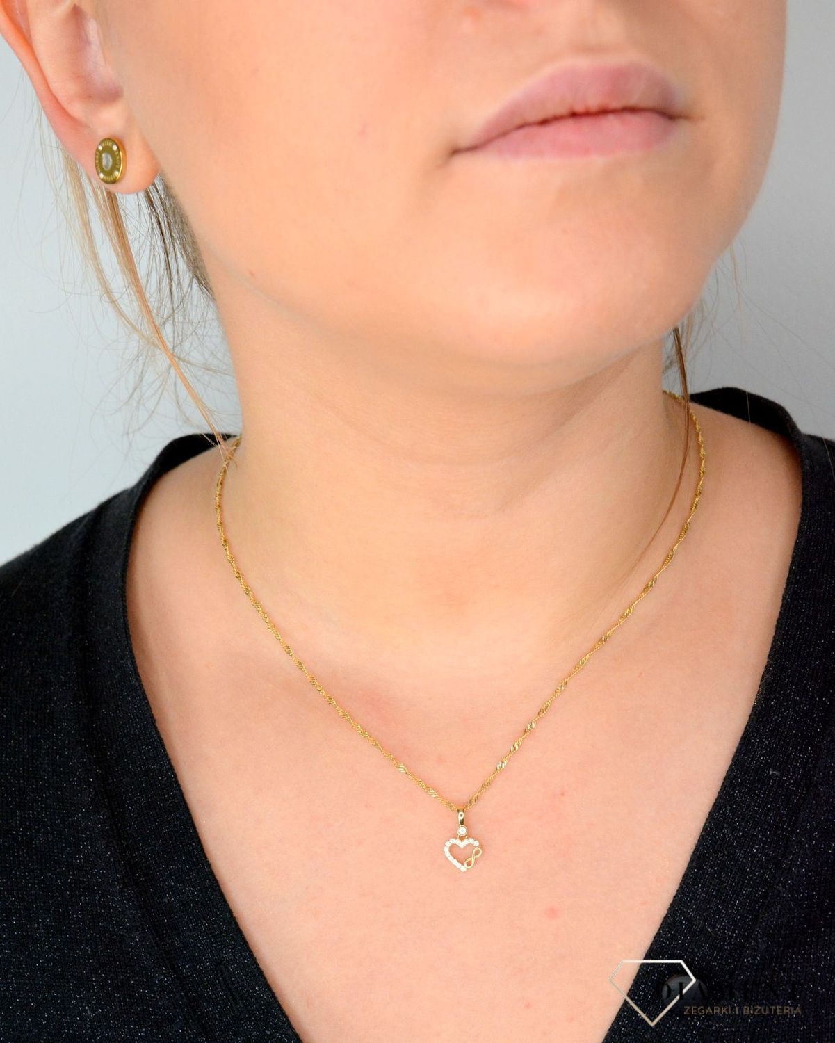 Złota zawieszka w kształcie serca ozdobionego cyrkonią oraz znak nieskończoności DIA-ZAW-4432-585.jpg