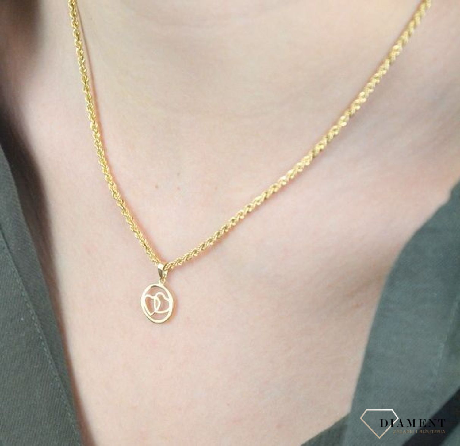 Złota zawieszka 585 serduszka w kółeczku DIA-ZAW-6246-585 to klasyczny element biżuterii mogącej pięknie ozdobić każdy kobiecy dekolt. To dodatek, który nie tylko pozwala uatrakcyjnić wizerunek, ale także w ciągu kilku chwil.jpg