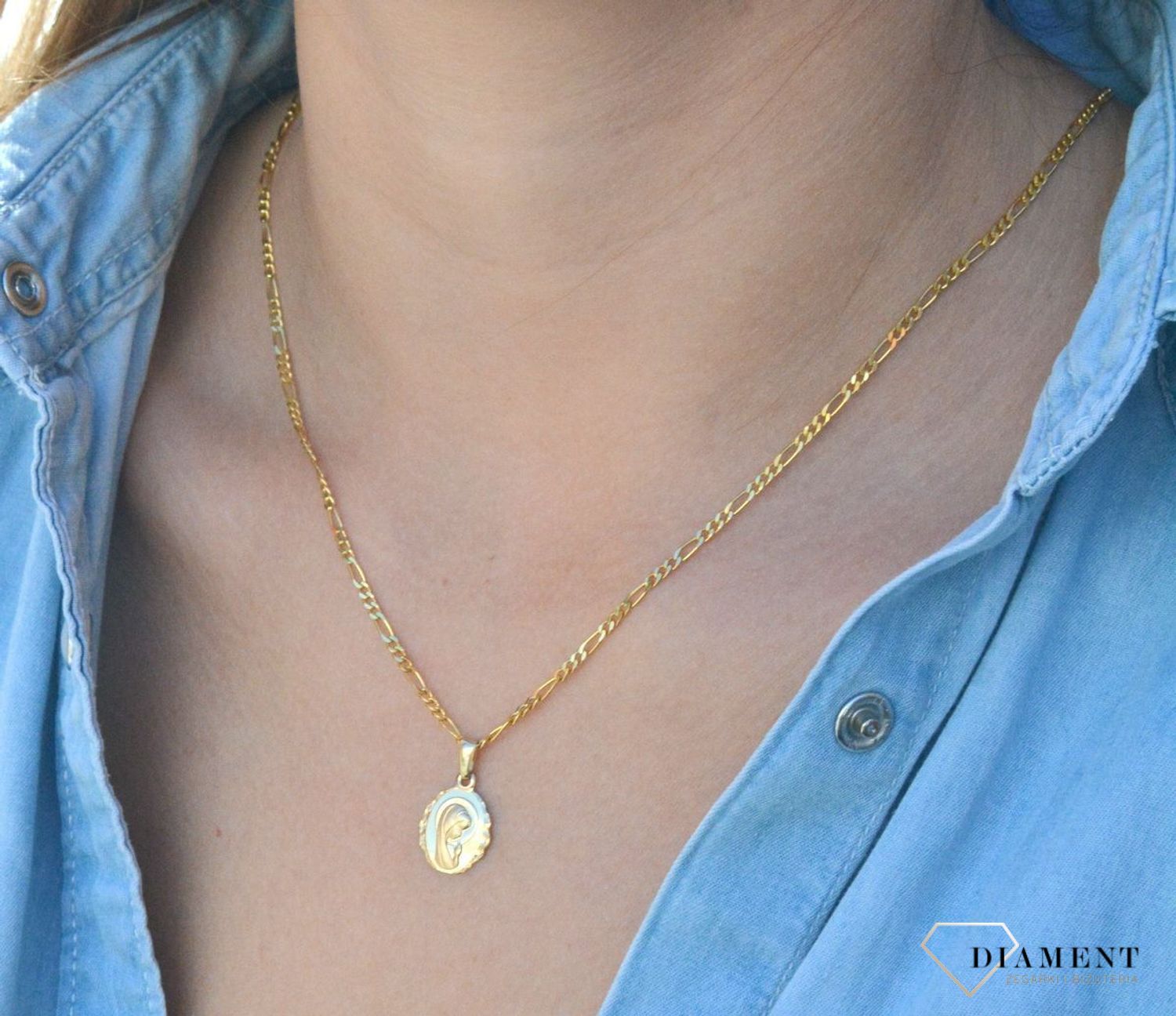 Złota zawieszka medalik 585 z Matką Boską DIA-ZAW-6264-585. Złota zawieszka medalik 585 'Matka Boska'. Złoty medalik został wykonany z najwyższej jakości 14 – karatowego żółtego złota. Idealnie się sprawdzi jako prezent. Złot.jpg