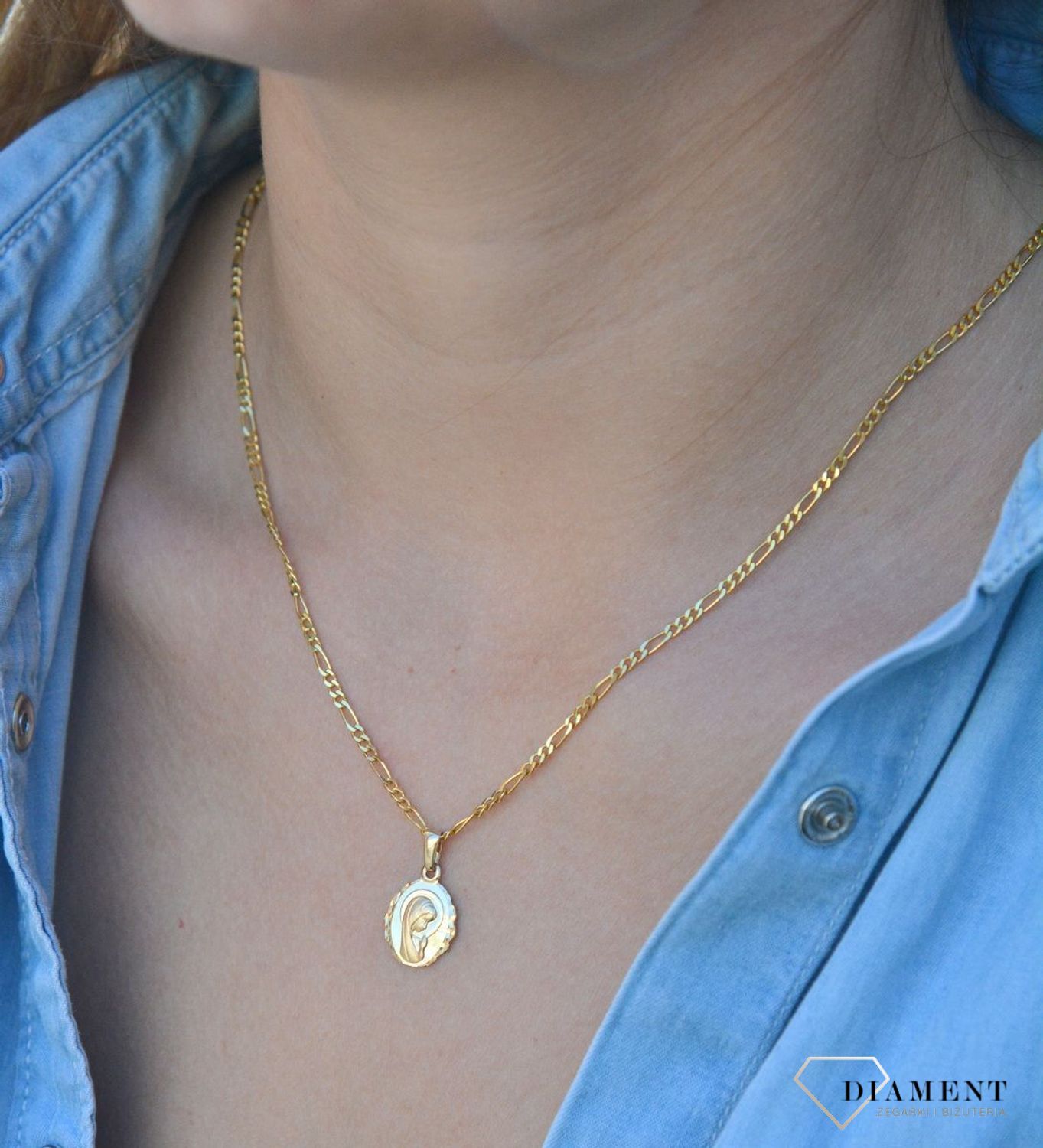 Złota zawieszka medalik 585 z Matką Boską DIA-ZAW-6264-585. Złota zawieszka medalik 585 'Matka Boska'. Złoty medalik został wykonany z najwyższej jakości 14 – karatowego żółtego złota. Idealnie się sprawdzi jako prezent. Złot.jpg