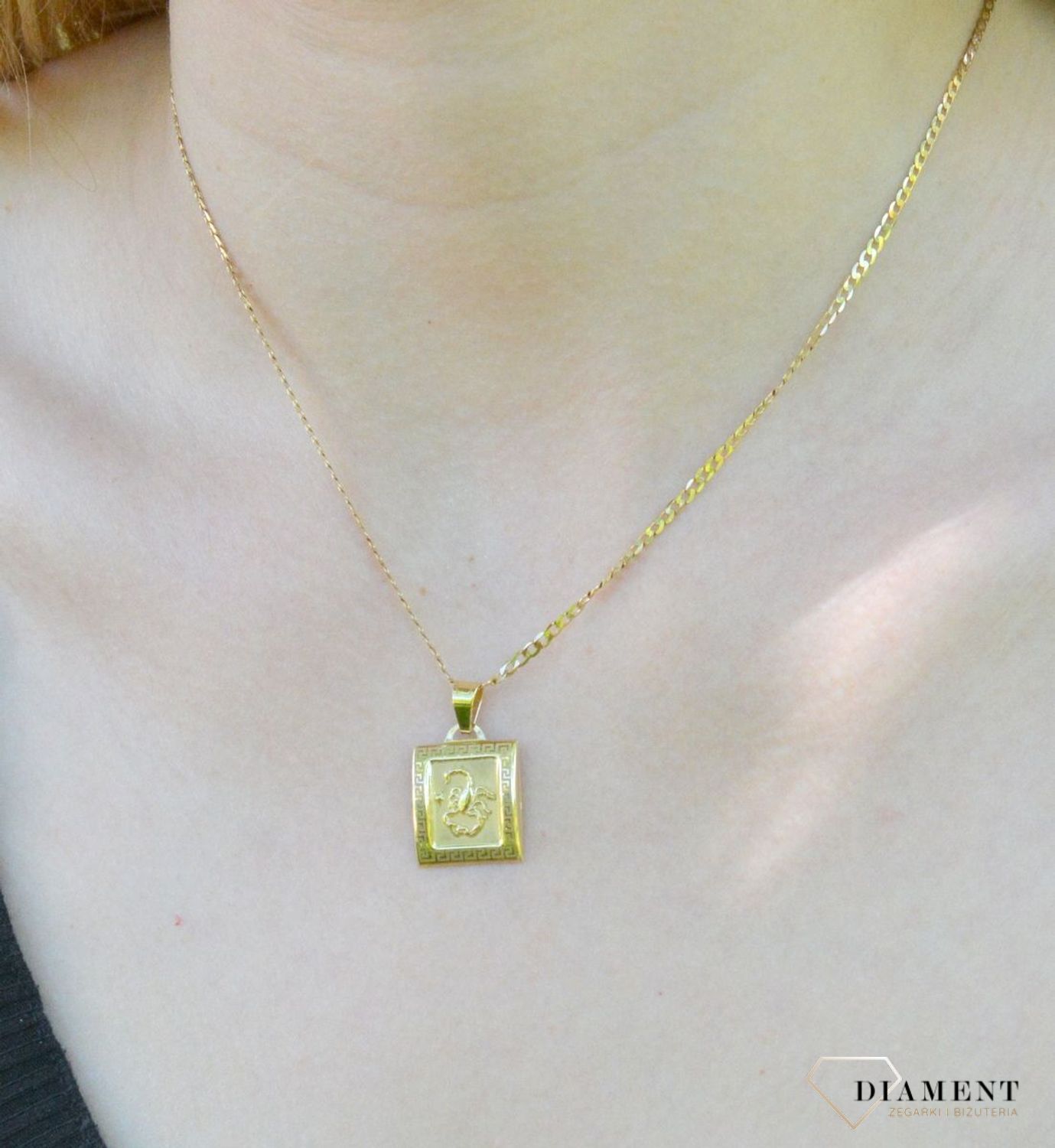 Złota zawieszka 585 znak zodiaku Skorpion DIA-ZAW-9065-585. Zawieszka została wykonana ze złota próby 585.Zawieszka będzie pięknym prezentem dla bliskiej osoby spod znaku skorpion. W naszej ofercie dostępne są także naszyjniki.jpg