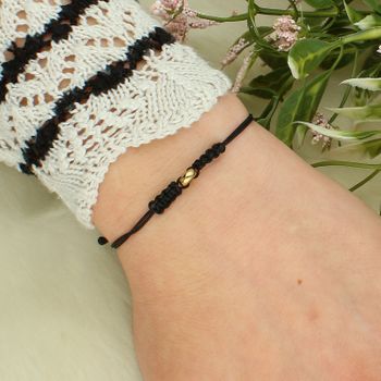 Bransoletka na czarnym sznurku ze złotą zawieszką 333 – regulowana, minimalistyczna black.jpg