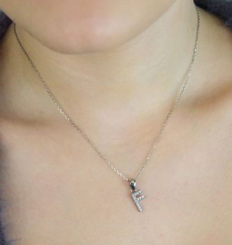 Zawieszka srebrna 925 DIA-ZAW-LITERKA-F2-925 – literka F zdobiona cyrkoniami. Wymiary 1,7x0,7 cm, waga 0,65 g. Subtelna, elegancka biżuteria z przesłaniem – idealna na prezent (1).JPG