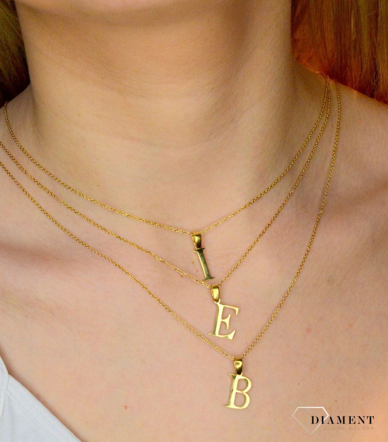 Stalowa zawieszka pozłacana Literka I 1,5 cm DIA-ZAW-ZI20617-STAL. Jedyna w swoim rodzaju stalowa zawieszka w kształcie literki I. Wisiorek został wykonany ze stali alergicznej w pozłoceniu. Modny wzór zawieszki będzie się pięk.JPG