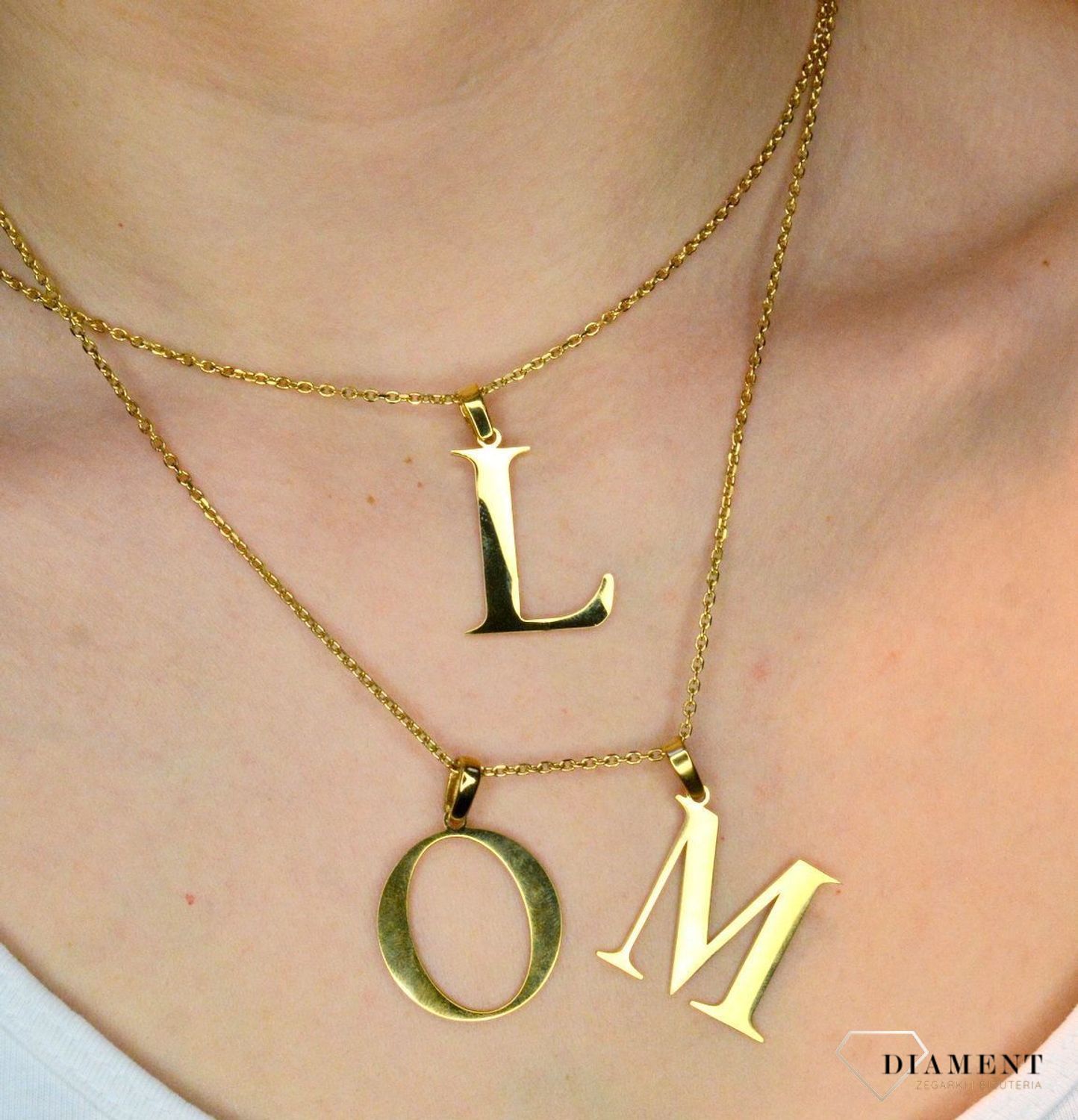 Stalowa zawieszka pozłacana Literka M 2,5 cm DIA-ZAW-ZM10819-STAL..JPEG