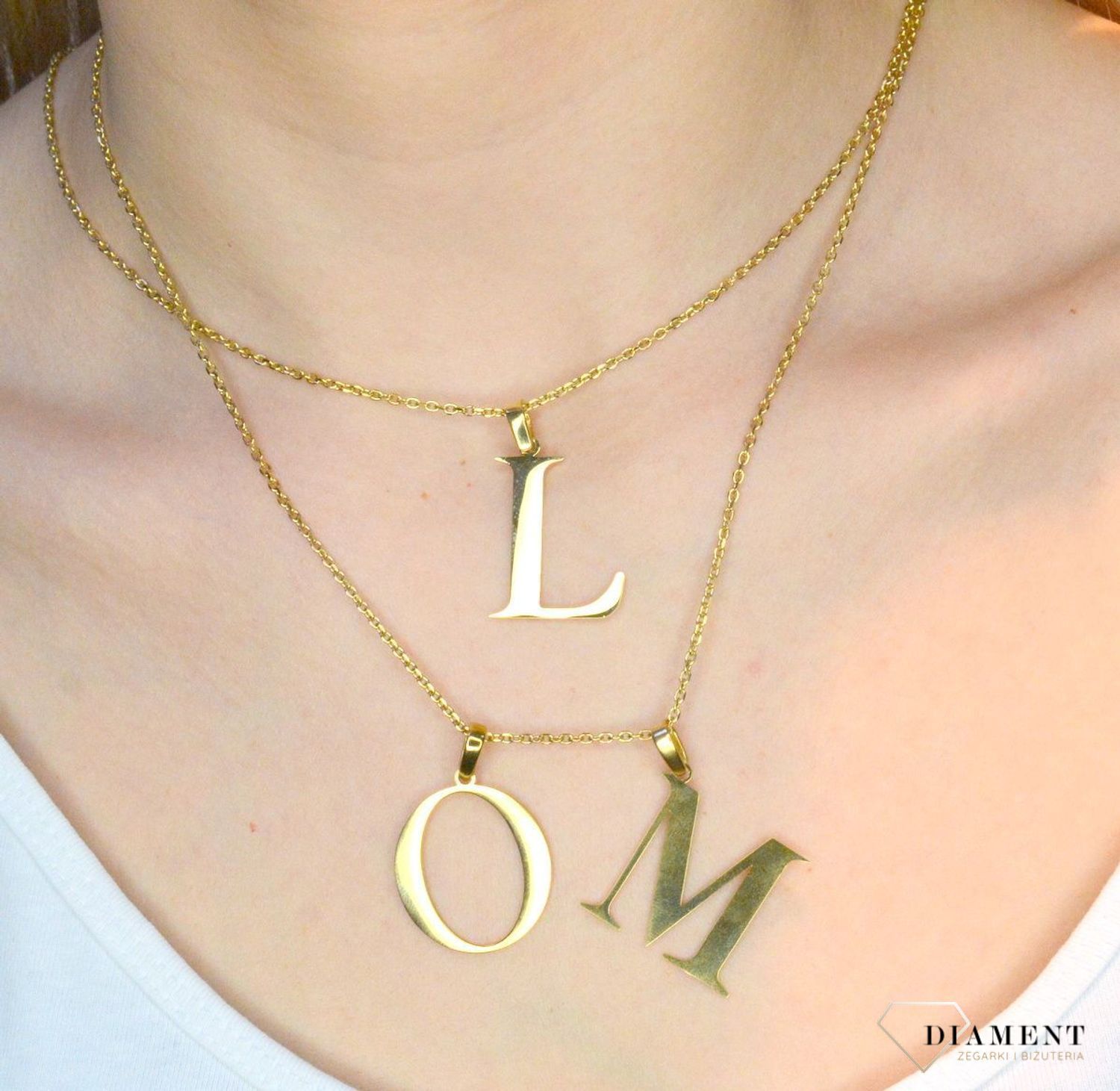 Stalowa zawieszka pozłacana Literka M 2,5 cm DIA-ZAW-ZM10819-STAL..JPEG