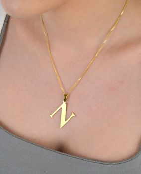 Zawieszka stalowa literka N pozłacana, DIA-ZAW-ZN10819-STAL Elegancka zawieszka w kształcie literki N, wykonana ze stali nierdzewnej i pozłacana, co zapewnia jej trwałość i wyjątkowy wygląd (1).JPG