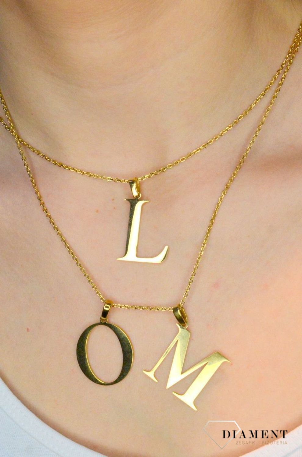 Stalowa zawieszka pozłacana Literka O 2,5 cm DIA-ZAW-ZO10819-STALc.jpg