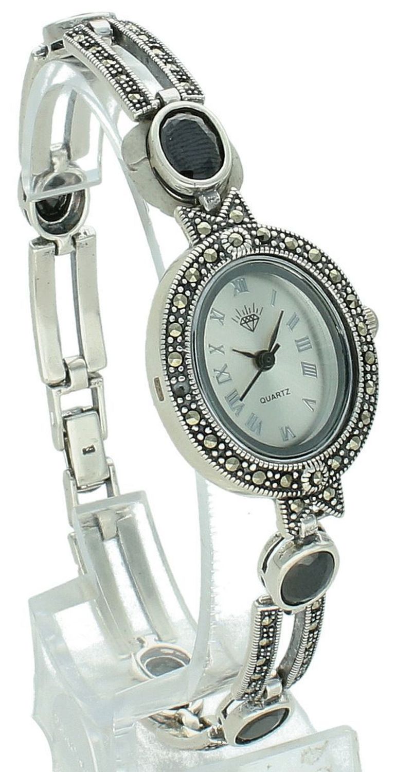 Elegancki zegarek damski ze srebra 925, waga 33,9 g. Owalna koperta 2,7 x 2,3 cm, bransoletka 21 cm x 7 mm, zdobiony markazytami i czarną cyrkonią. Grawer gratis – idealny na prezent.1.jpg