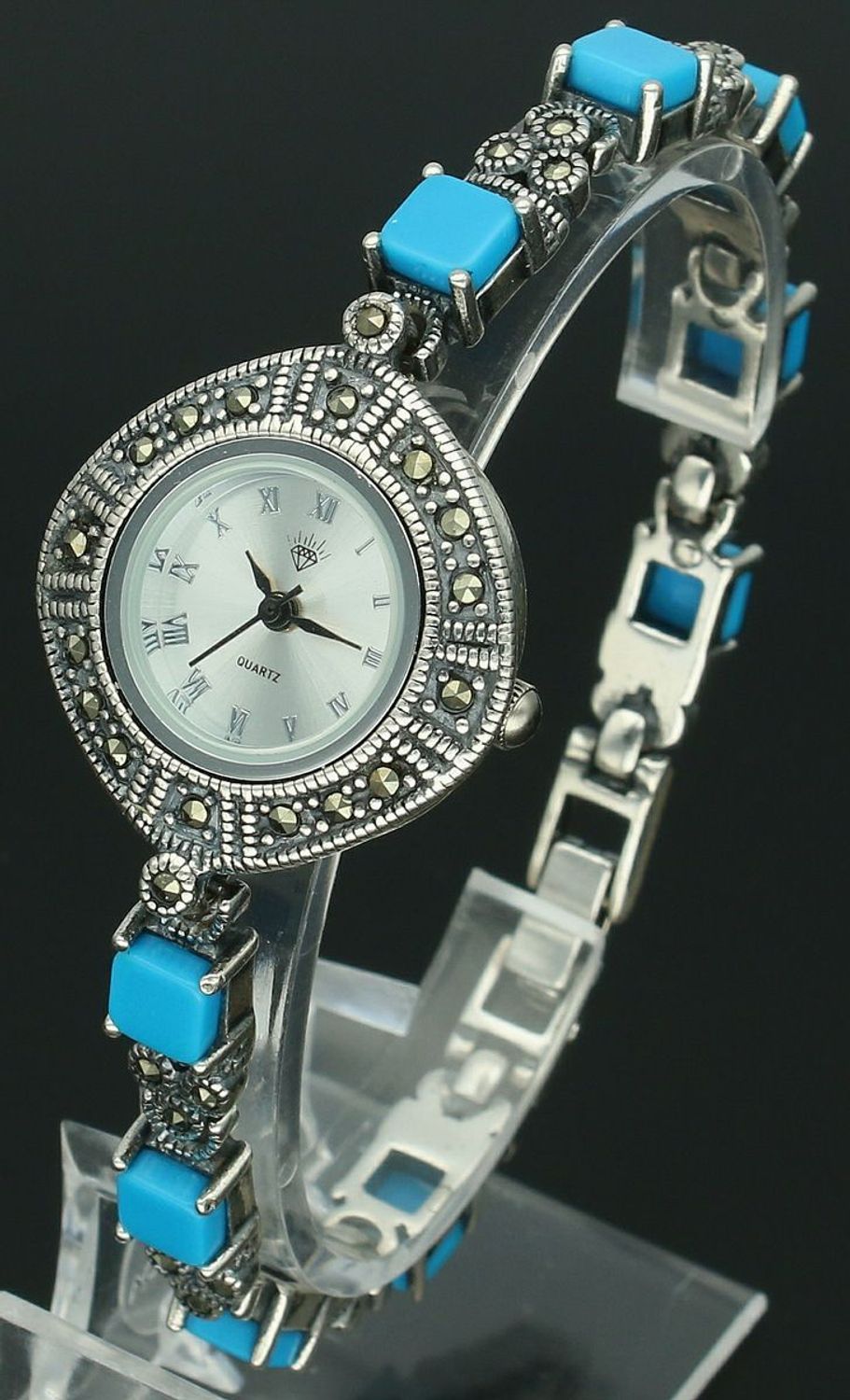 Elegancki zegarek damski ze srebra 925, waga 33,6 g. Koperta 2,7 cm, bransoletka 18 cm x 6 mm, zdobiony markazytami i turkusami. Grawer gratis – idealny na prezent.11.jpg