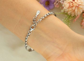 Elegancki zegarek damski ze srebra 925, waga 24 g. Owalna koperta 2,2 x 2,5 cm, bransoletka 17+3 cm, zdobiony markazytami i szmaragdami. Grawer gratis – idealny na prezent.10.jpg