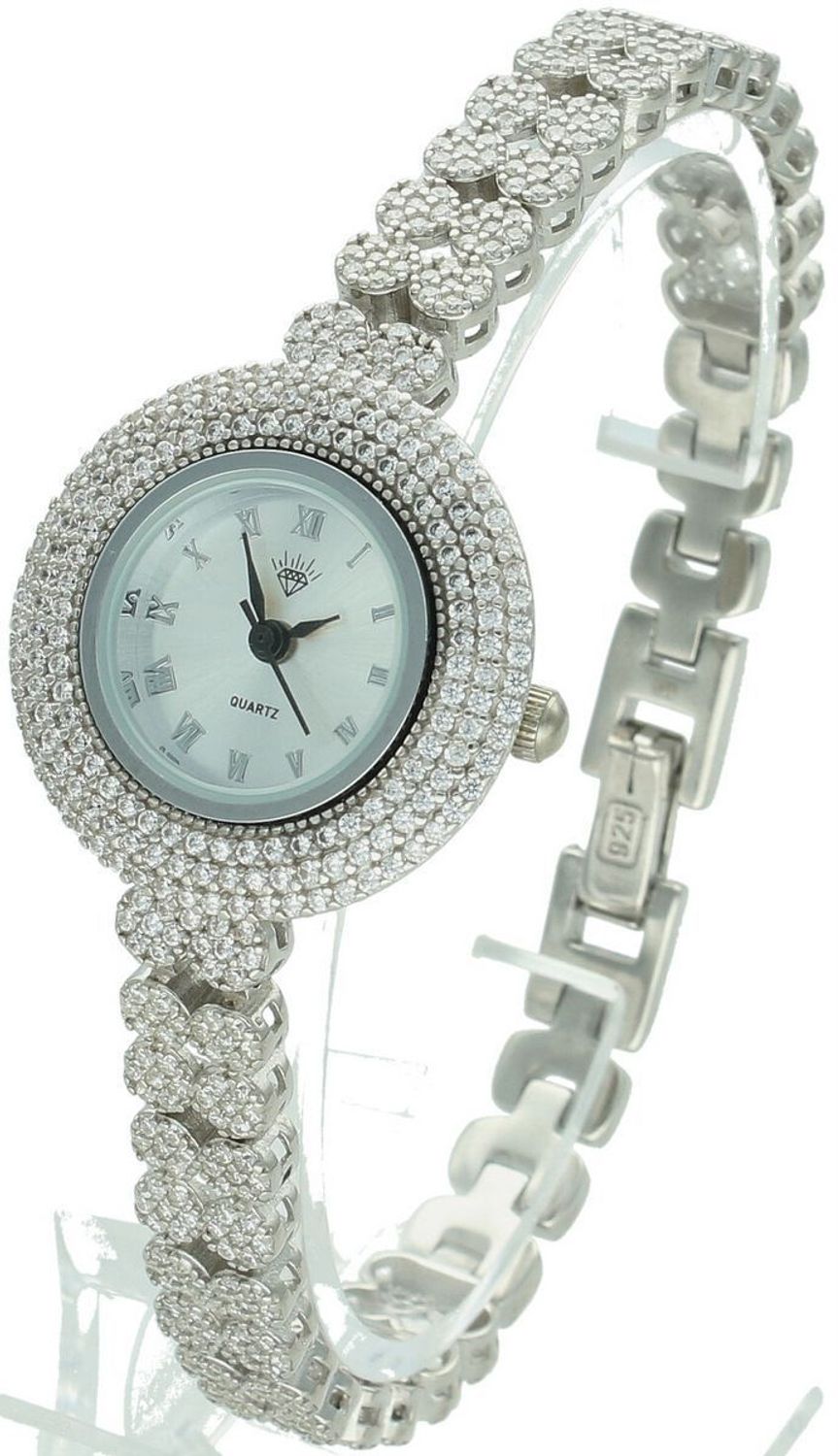 Zegarek damski srebrny DIA-ZEG-13855-925 z całym zdobieniem białymi cyrkoniami. Okrągła koperta 2,6 cm, grubość 6 mm, zapięcie na zatrzask. Elegancki i efektowny dodatek.1.jpg