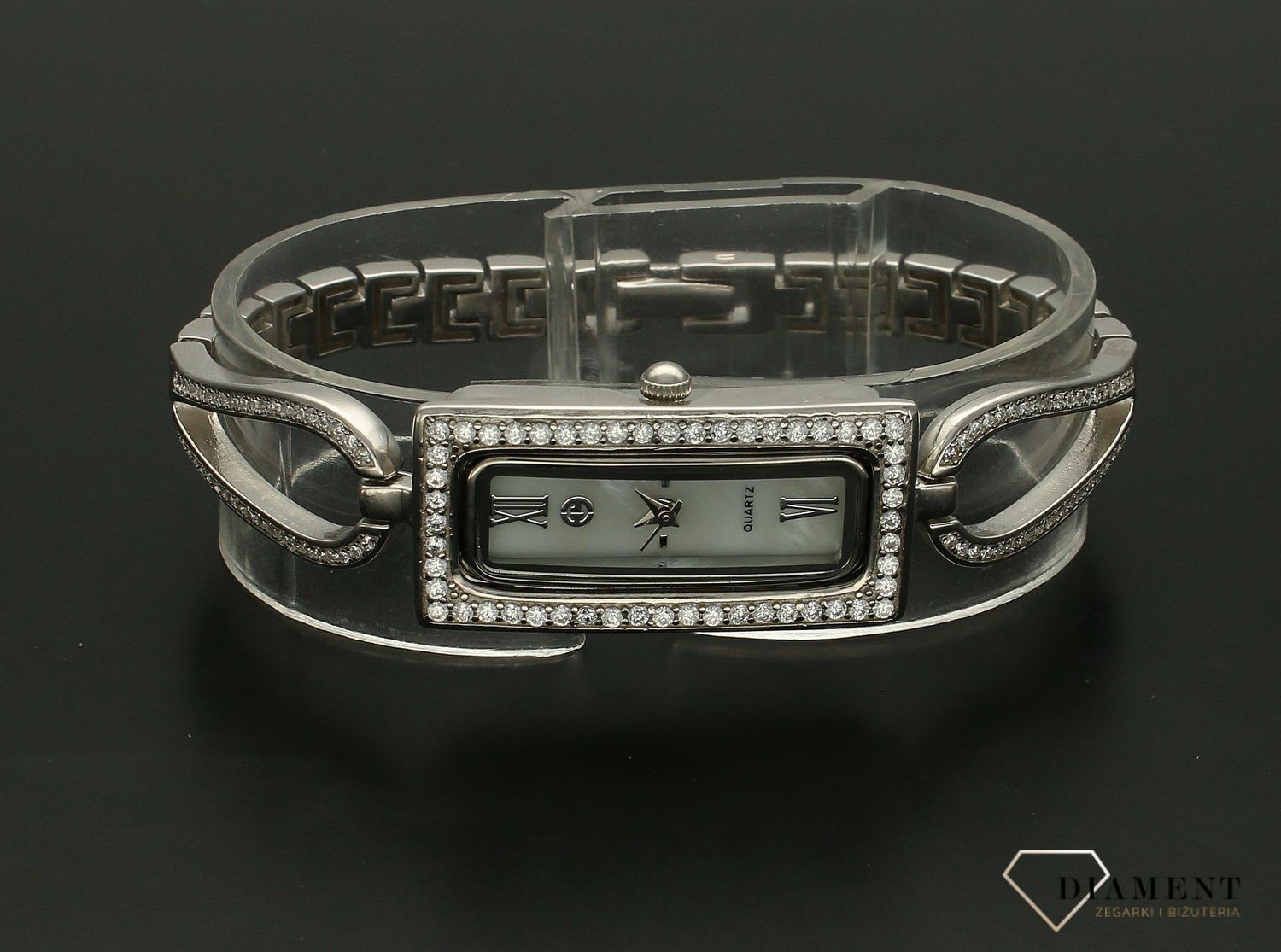 Zegarek srebrny biżuteryjny z prostokątna tarczą DIA-ZEG-9380-925. Elegancki zegarek z prostokątną tarczą ze srebra z cyrkoniami idealnie sprawdzi się jako ekskluzywny dodatek do białych koszul i koktajlowych sukienek. Zegar (3).jpg