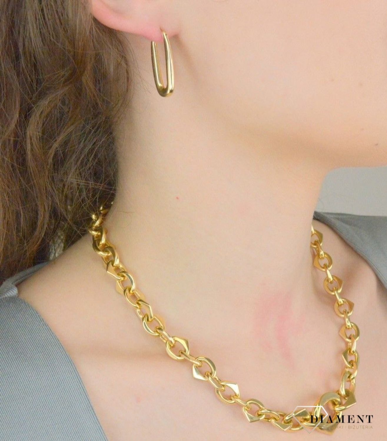 Kolczyki damskie złote pr 585, E3NUO14334 Złote kolczyki wykonane z najwyższej jakości żółtego złota, próba 585. Kolczyki w modowym stylu, wpisujące się w obecne trendy modowe. Delikatna forma1.jpg