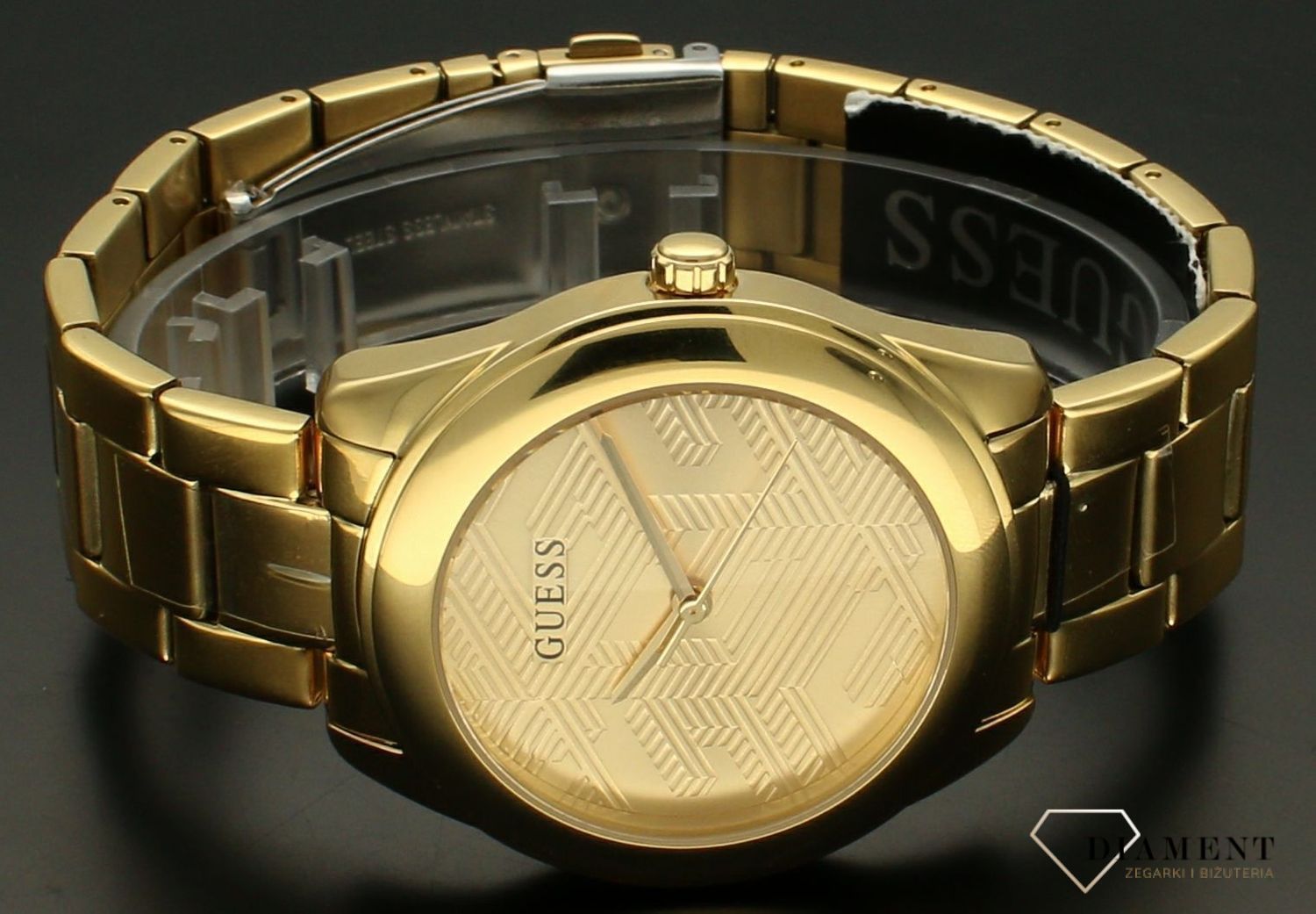Zegarek damski GUESS GW0606L2 to nowoczesny, elegancki model zegarka. Bransoleta i koperta w kolorze żółtego złota. Tarcza zegarka w złotym kolorze z geometrycznymi wzorami. Idealny na prezent dla bliskiej osoby.121212.jpg