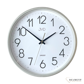 Ścienny zegar JVD HX2487.2 wyposażony jest w kwarcowy mechanizm, zasilany za pomocą baterii. Posiada bardzo wysoką dokładność mierzenia czasu +- 10 sekund w przeciągu 30 dni..png
