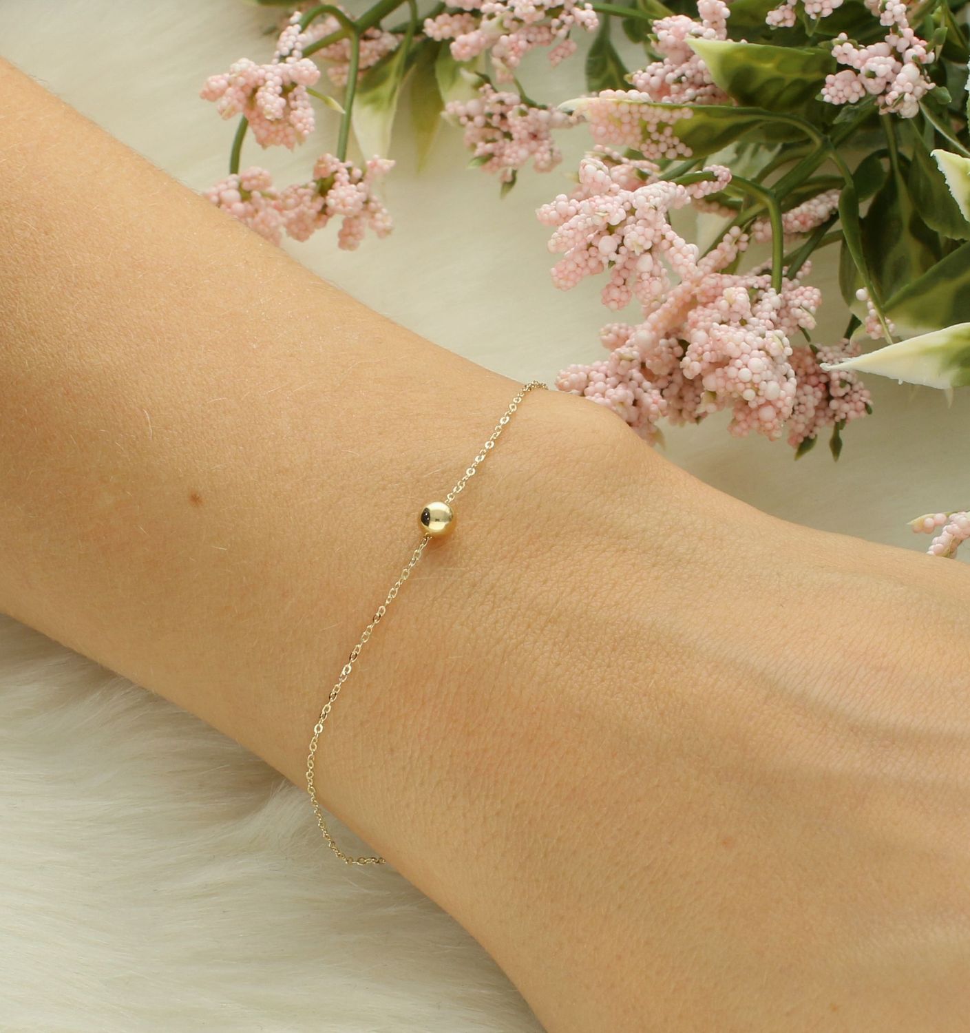 Bransoletka złota damska z kuleczką próba 585, JMG0048WGB Bransoletka to idealny pomysł na prezent. Złota bransoletka z perłowymi koniczynkami. Bransoletka o oryginalnym wzorze ładnie układającym się na ręce. 5.jpg