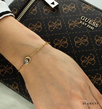 Bransoletka damska Guess z logo Guess i białą cyrkonią JUBB03392JWYGS (2).jpg