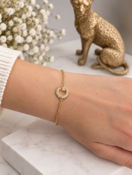 Bransoletka damska GUESS JUBB05442JWYGS stalowa złota z logo G i cyrkoniami (1).jpg