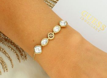 Damska bransoletka Guess JUBB05503JWYGS – stal szlachetna z kryształami i logo kryształki.jpg