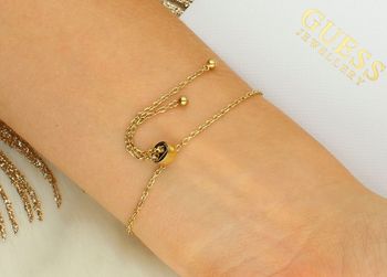 Damska bransoletka Guess JUBB05503JWYGS – stal szlachetna z kryształami i logo zapięcie.jpg