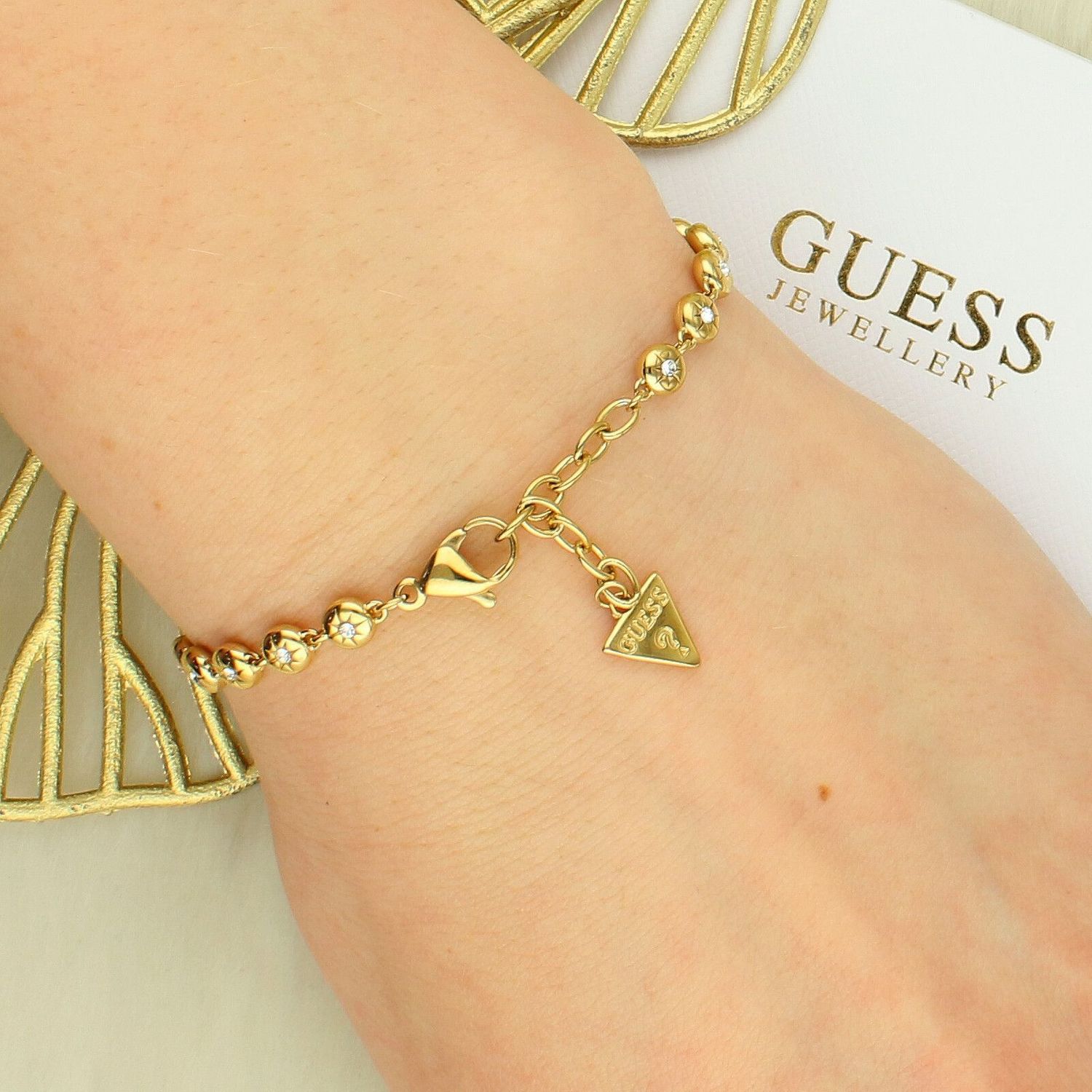 Bransoletka Guess JUBB06235JWYGS ze stali nierdzewnej w kolorze żółtym z cyrkoniami – regulowana 15-19 cm.jpg