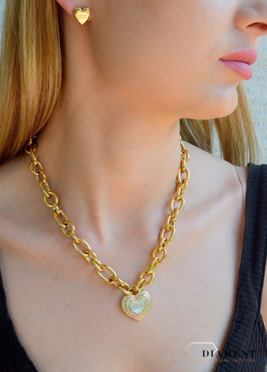 Naszyjnik damski GUESS JUBN04023JWYGWHT-U pokryty złotem z zawieszką serce z cyrkoniami i masą perłową.png