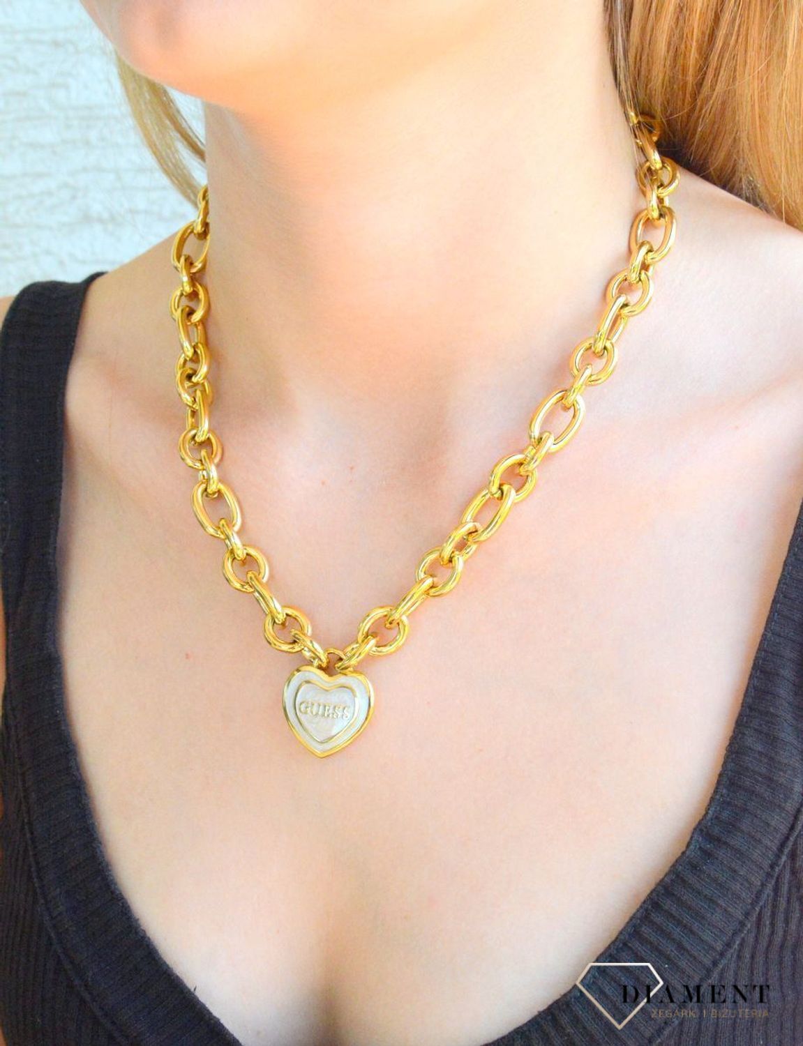 Naszyjnik damski GUESS JUBN04023JWYGWHT-U pokryty złotem z zawieszką serce z cyrkoniami i masą perłową.png