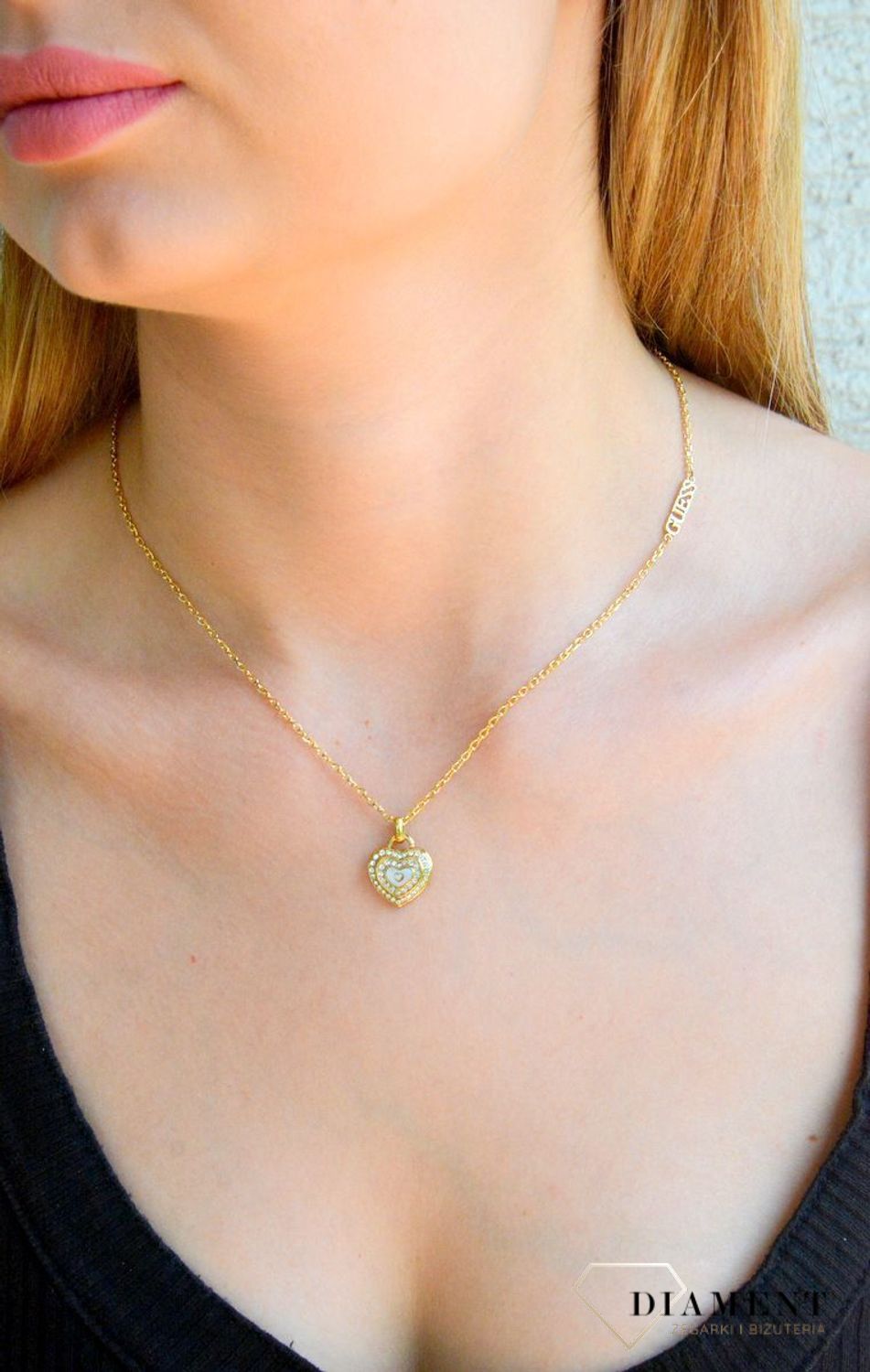 Naszyjnik damski Guess Amami z masą perłową JUBN04026JWYGWHT-U. Oryginalny naszyjnik marki Guess. Biżuteria Guess na prezent dla kobiety. Naszyjnik z sercem Guess..jpg