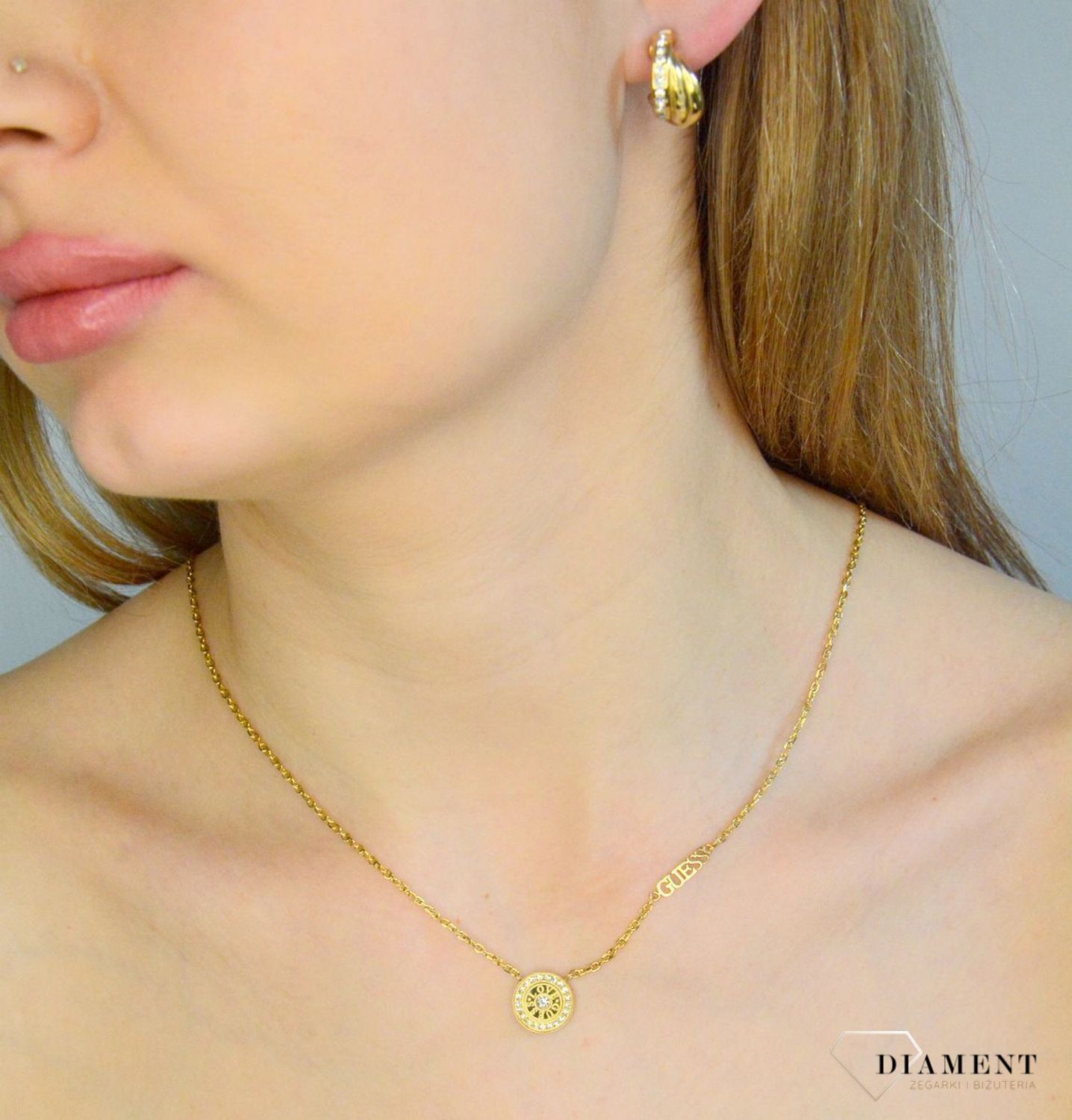 Naszyjnik damski LOVE GUESS pokryty złotem z okrągłą zawieszką ozdobioną cyrkoniami JUBN04080JWYGT-U.png