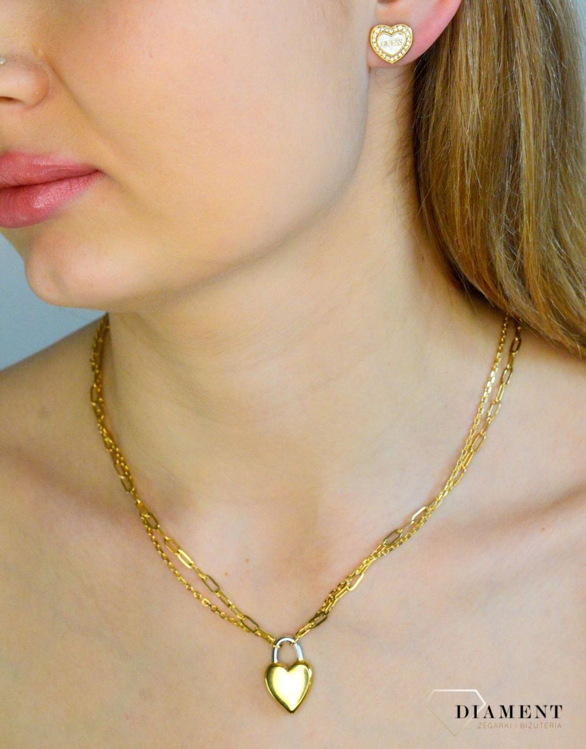 Naszyjnik damski pokryty złotem z kłódką w kształcie serca i logo GUESS JUBN04208JWYGRHT-U.png