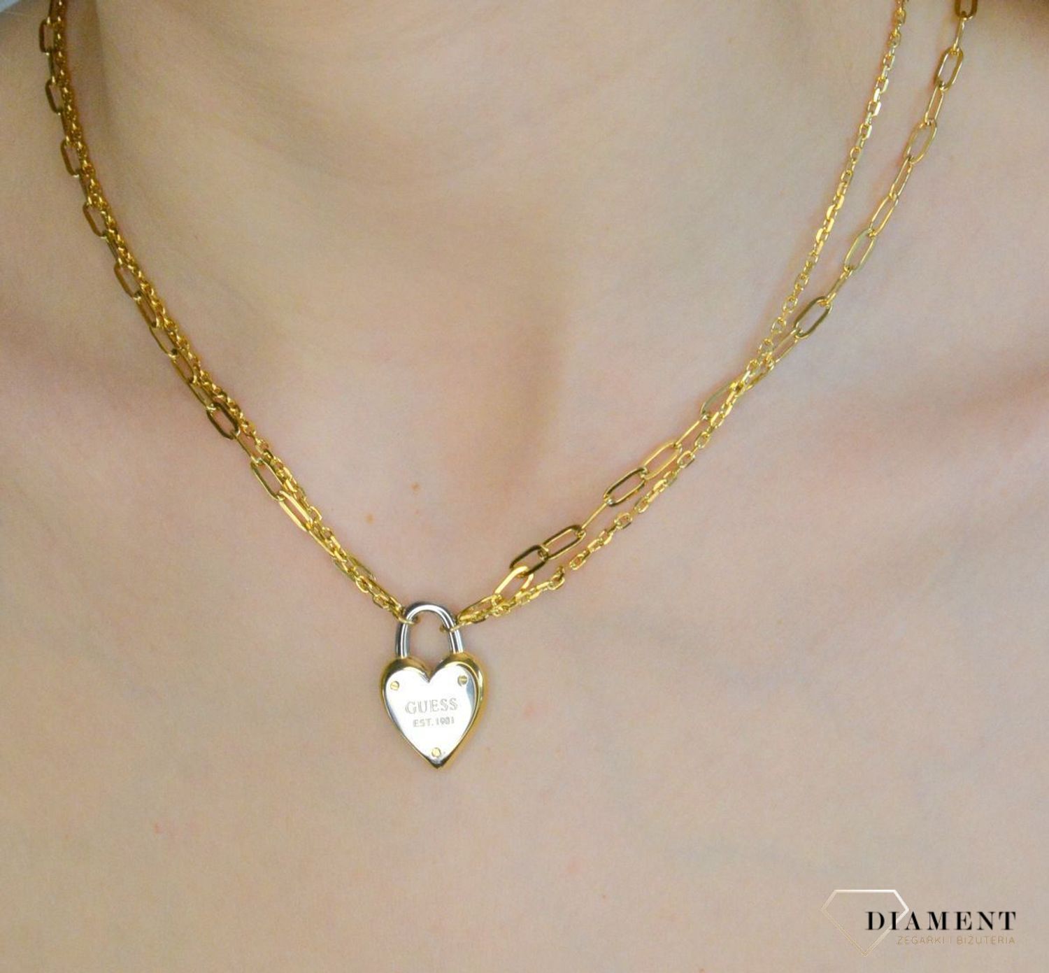 Naszyjnik damski pokryty złotem z kłódką w kształcie serca i logo GUESS JUBN04208JWYGRHT-U.png