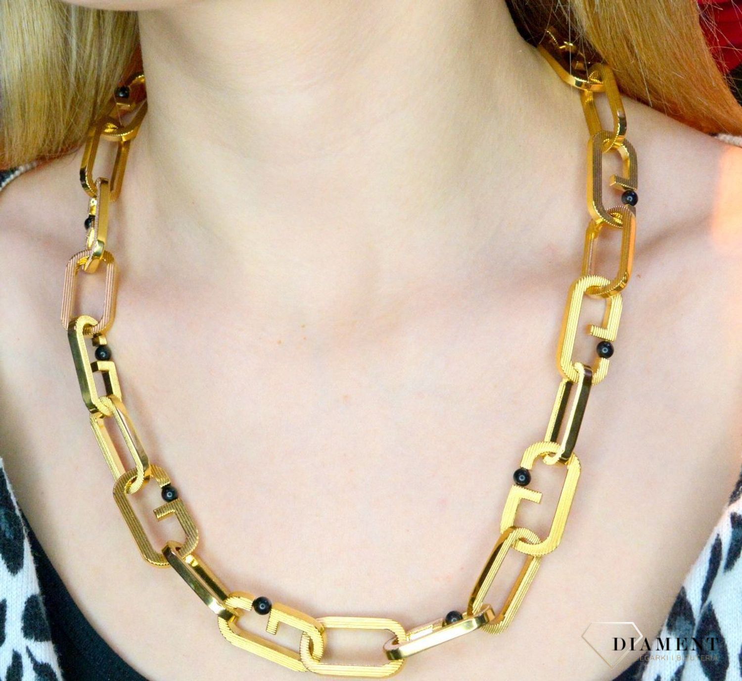 Naszyjnik męski, stal GUESS w kolorze złotym z czarnymi kulkami JUMN02120JWYGT.webp