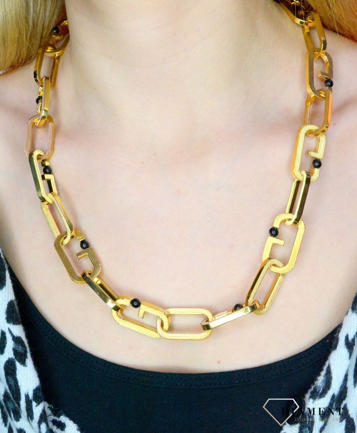 Naszyjnik męski, stal GUESS w kolorze złotym z czarnymi kulkami JUMN02120JWYGT.webp