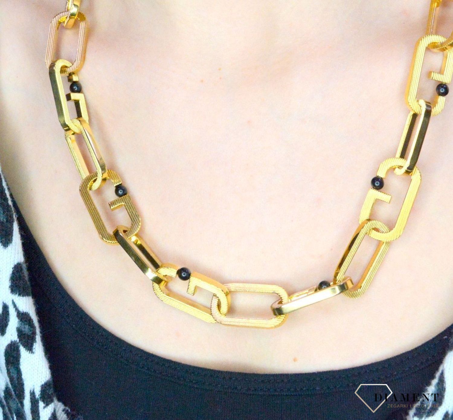 Naszyjnik męski, stal GUESS w kolorze złotym z czarnymi kulkami JUMN02120JWYGT.webp