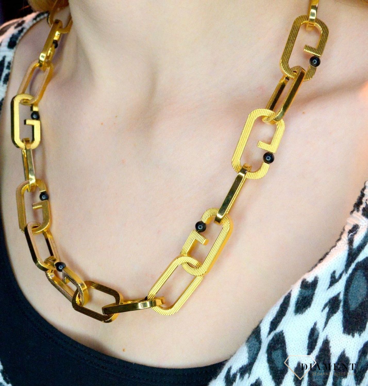 Naszyjnik męski, stal GUESS w kolorze złotym z czarnymi kulkami JUMN02120JWYGT.webp